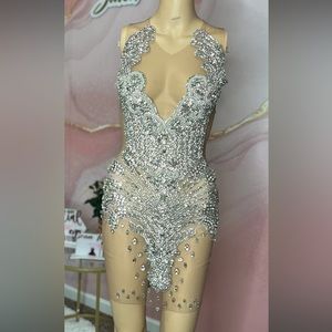 This is a custom short rhinestone dress with grey back and sheer front